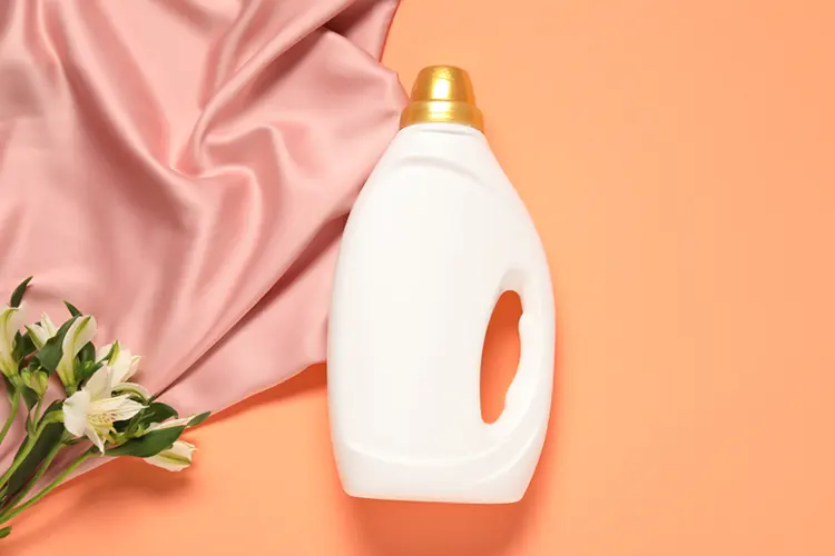Organic laundry detergent bottle with pink silk fabric